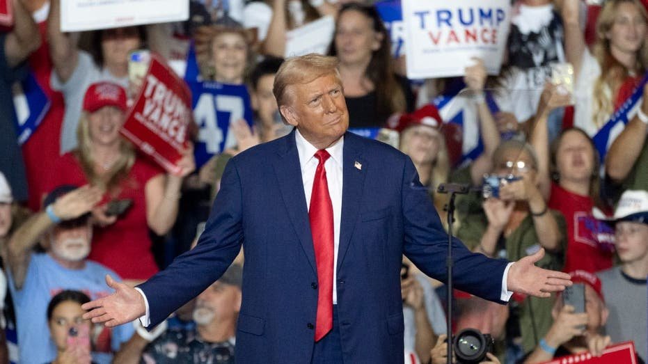 Trump gestures at a rally